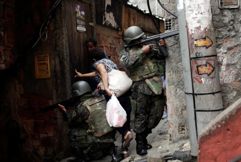Members of the Armed Forces take up position during a operation after violent clashes between drug gangs in Rocinha slum in Rio de Janeiro, Brazil, September 22, 2017.