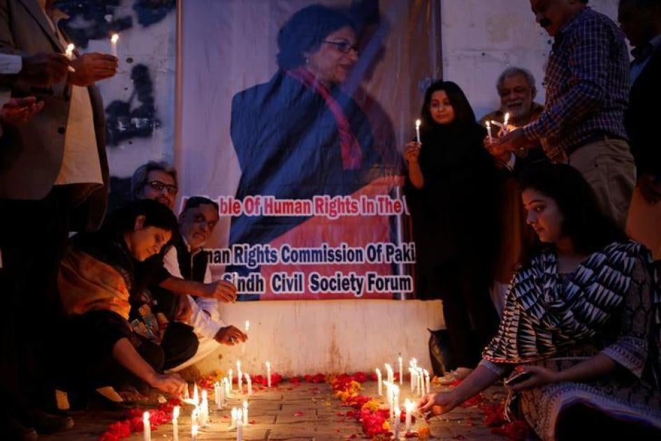 People light candles for the human rights campaigner Asma Jahangir, who died on Sunday in Lahore, during candlelight vigil in Karachi, Pakistan February 12, 2018. 
