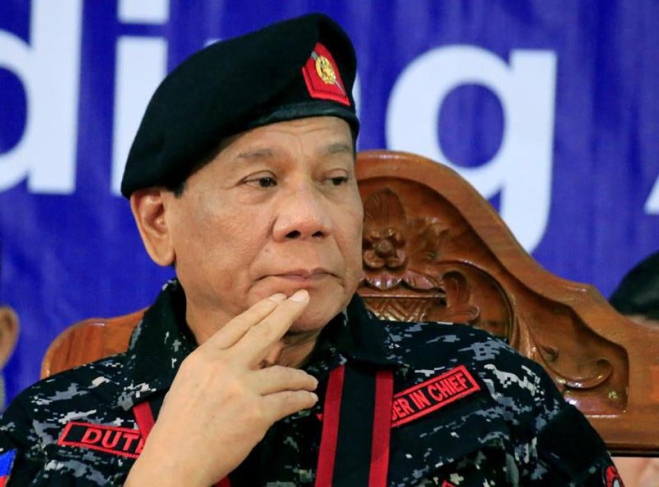 Philippine President Rodrigo Duterte, wearing a military uniform, gestures as he attends the 67th founding anniversary of the First Scout Ranger regiment in San Miguel town, Bulacan province, north of Manila, Philippines November 24, 2017.