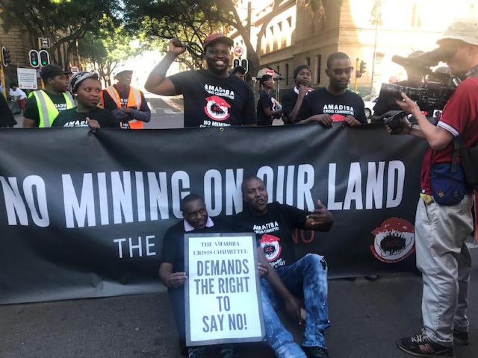 Xolobeni community members and environmental activists march and chant slogans in front of South Africa's Pretoria High Court, April 24, 2018. 