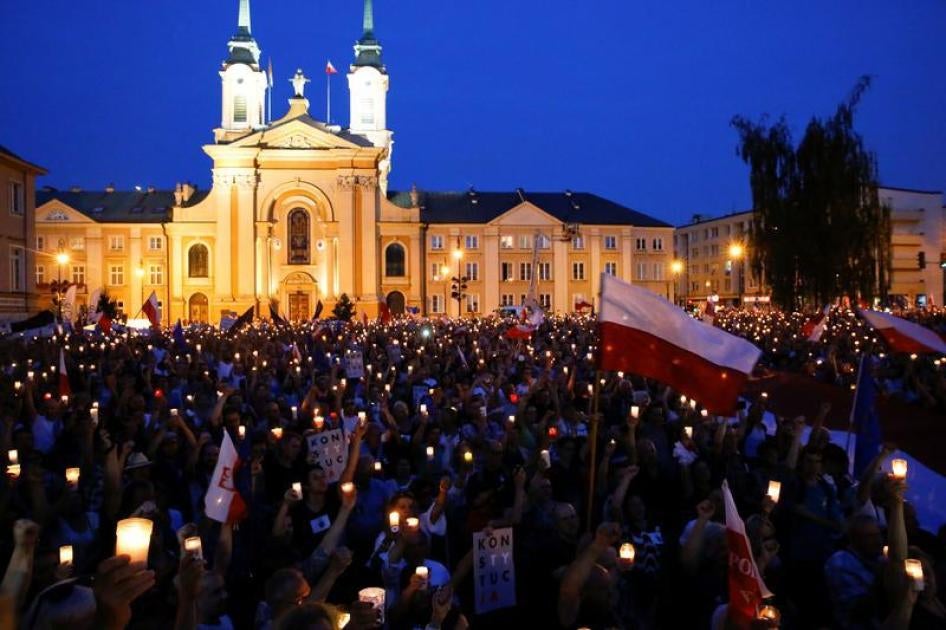 People gather in front of the Supreme Court during a protest against the Supreme Court legislation in Warsaw, Poland, July 22, 2017. 