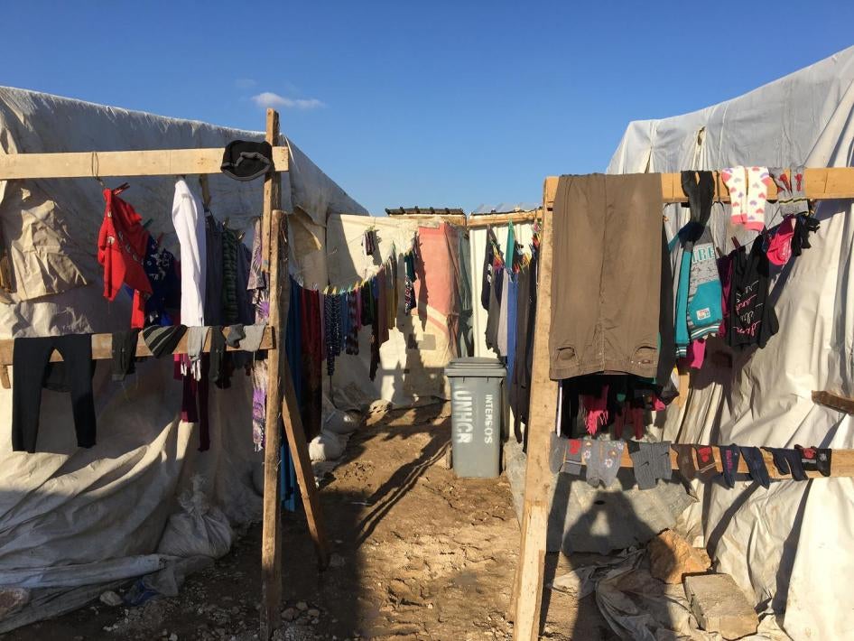A clothesline in an informal tent settlement in Bar Elias, Bekaa Governorate, Lebanon. Refugees evicted from the Rayak air base area settled here in January 2018. The refugees say there was no procedure, no written notice, no opportunity to discuss or cha