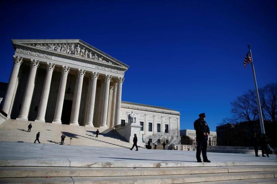 Police officers stand in front of the U.S. Supreme Court in Washington, U.S., January 19, 2018.