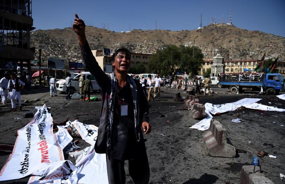An Afghan protester cries out near the scene of the suicide attack that targeted a demonstration of mainly Shia Hazaras at Deh Mazang Square in Kabul, July 23, 2016.