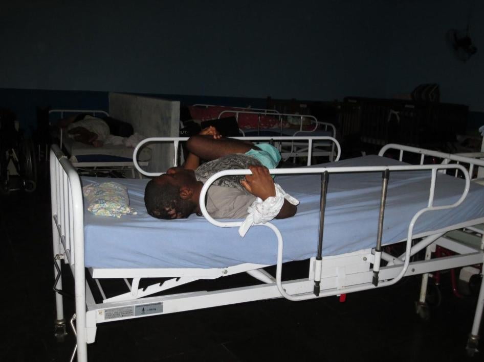 A young man restrained to his bed in an institution for 32 people with disabilities in Rio de Janeiro.
