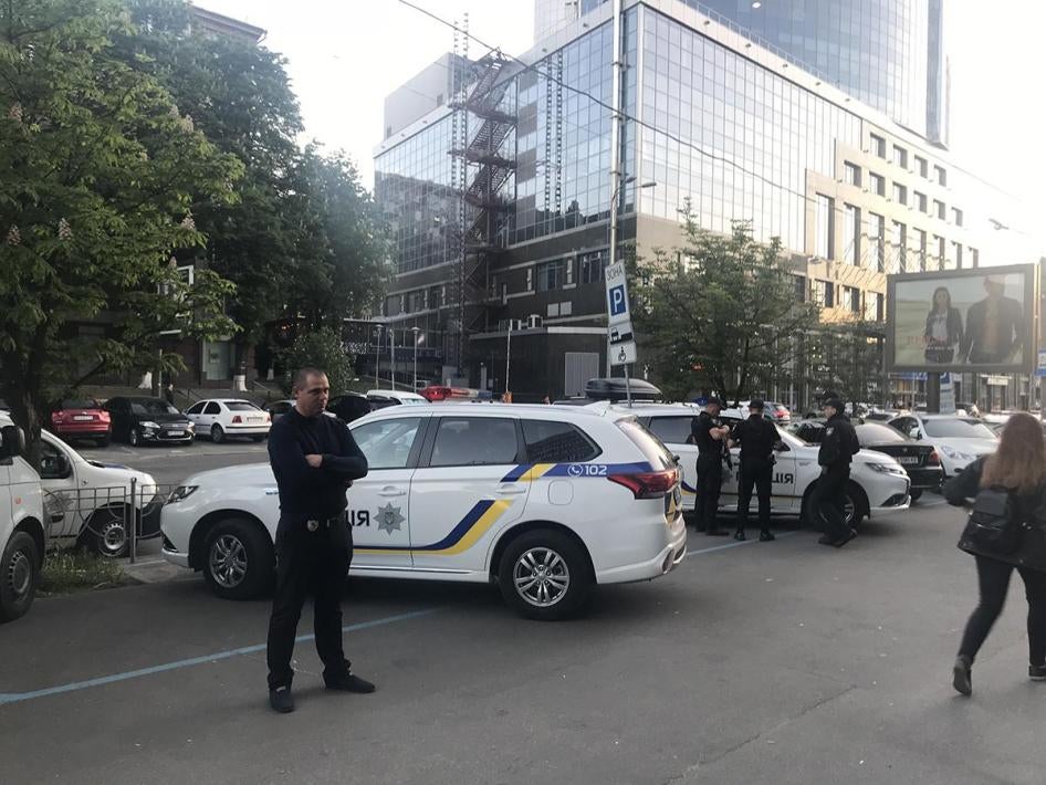 Kyiv police waiting outside the venue where an Amnesty International event was disrupted by members of radical groups.