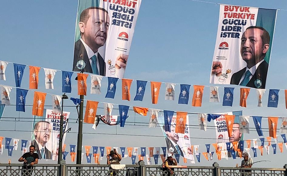 President Recep Tayyip Erdogan’s campaign posters read “Great Turkey wants a strong leader”, flying above election banners for the ruling Justice and Development Party (AKP) he chairs, Galata Bridge, Istanbul, June 2018.