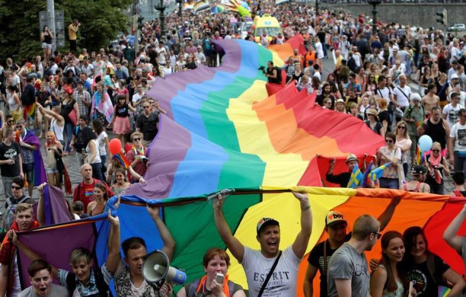 Participants hold a giant rainbow flag during the Prague Pride Parade where thousands marched through the city centre in support of gay rights, in Czech Republic, August 13, 2016. 