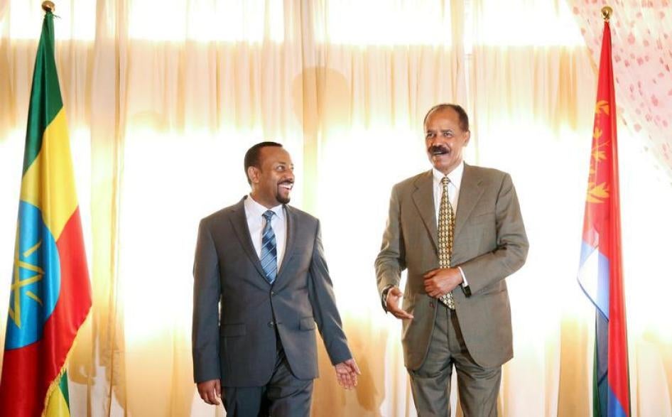 Eritrea's President, Isaias Afwerki talks to Ethiopia's Prime Minister, Abiy Ahmed during the Inauguration ceremony marking the reopening of the Eritrean Embassy in Addis Ababa, Ethiopia July 16, 2018. 