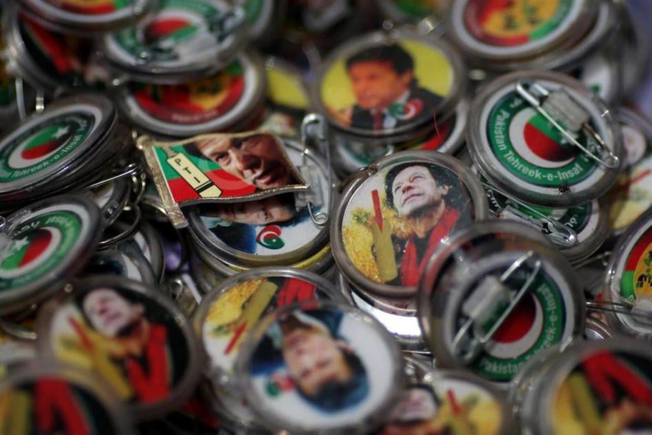 Pins with images of Imran Khan are pictured after the general election in Islamabad, Pakistan, July 26, 2018.