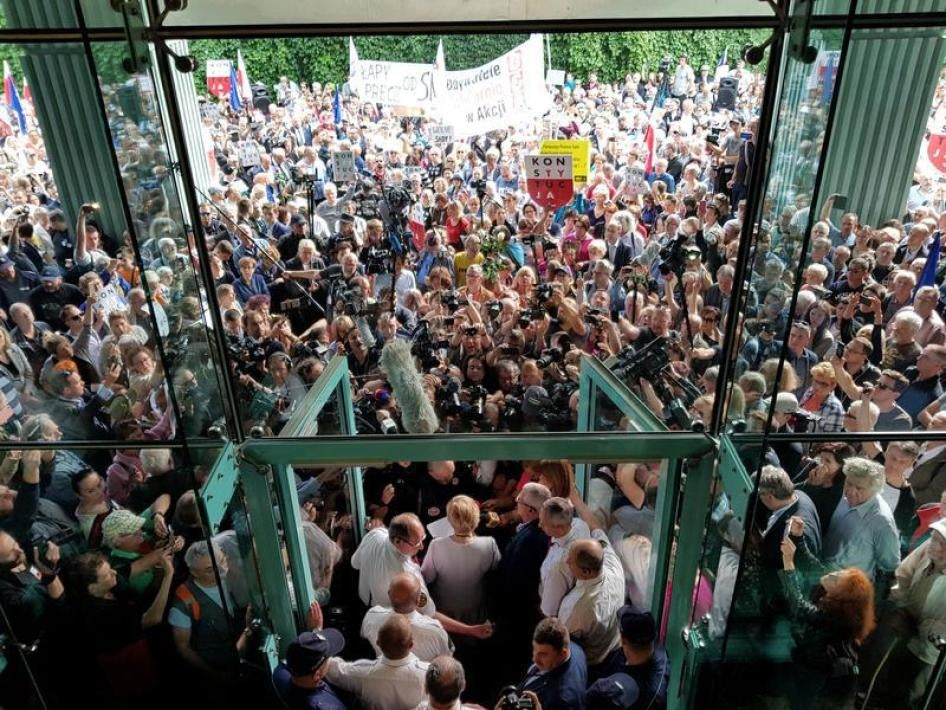Supreme Court President Malgorzata Gersdorf addresses the supporters and the media before entering the Supreme Court building in Warsaw, Poland, July 4, 2018.