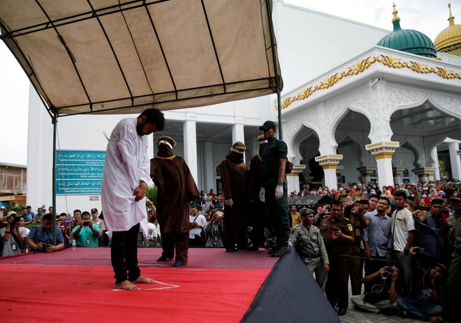 Local authorities publicly cane a man for having gay sex, in Banda Aceh, Aceh province, May 23, 2017. 
