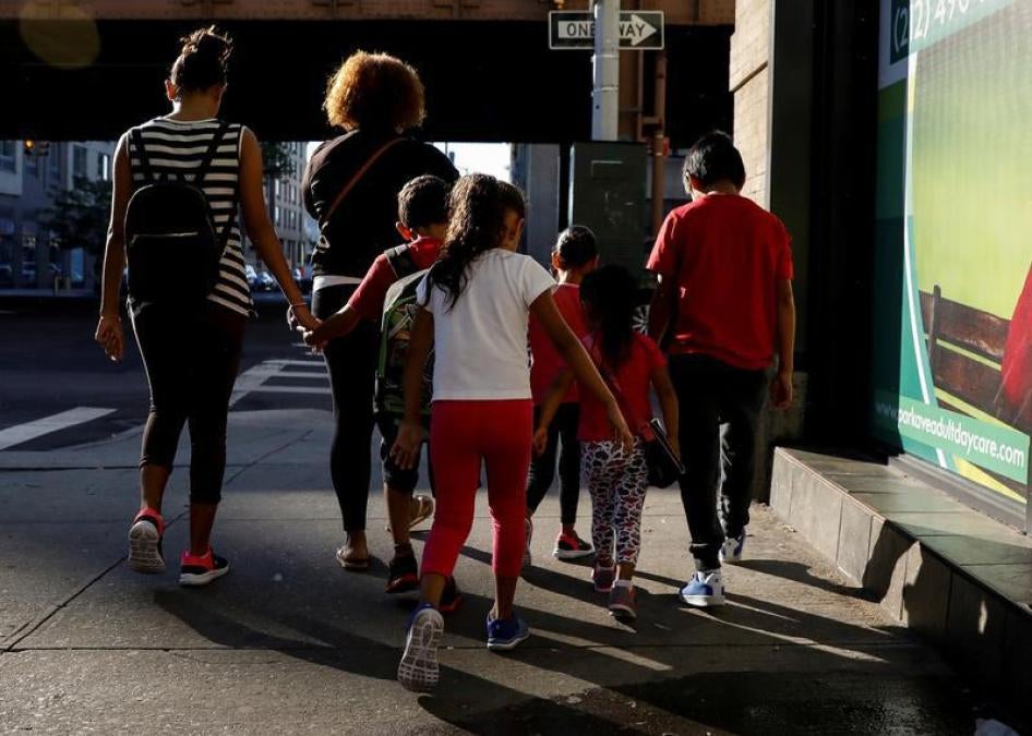 Children are escorted to the Cayuga Center, which provides foster care and other services to immigrant children separated from their families, in New York City, U.S., July 10, 2018. 