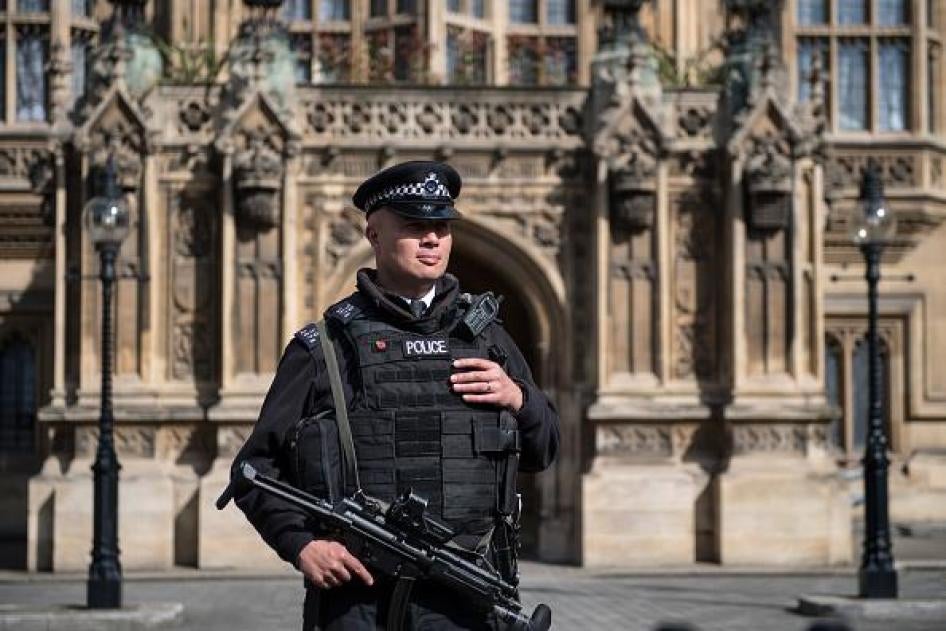 An armed police officer stands guard outside the Houses of Parliament in London, April 2017.