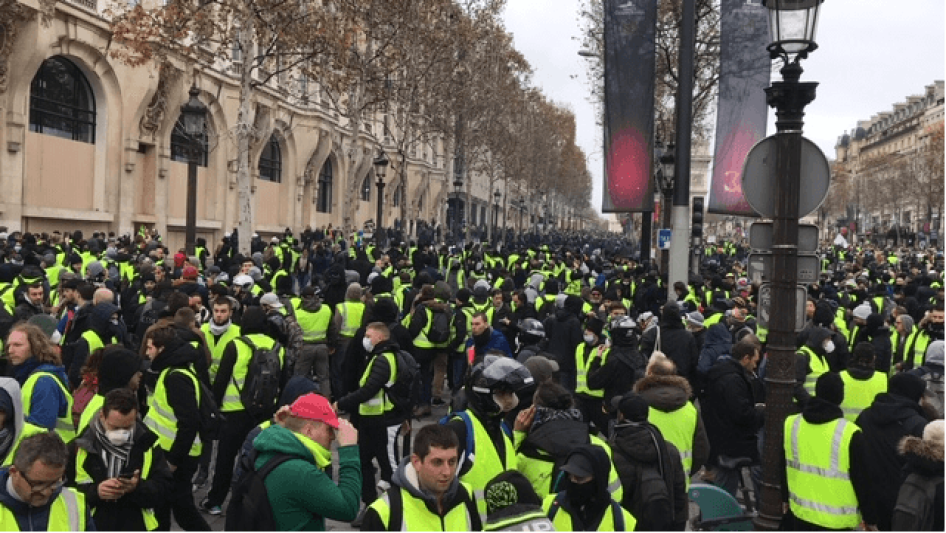 Yellow vest demonstrators gather on Champs Élysées Avenue, Paris on December 8, 2018.