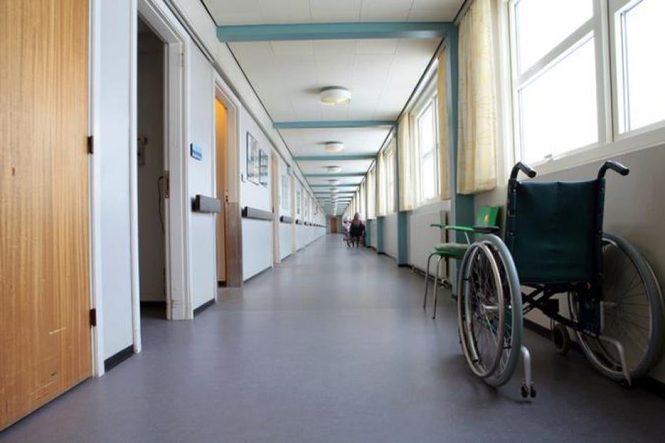 Wheelchair in the hallway of a care facility. 