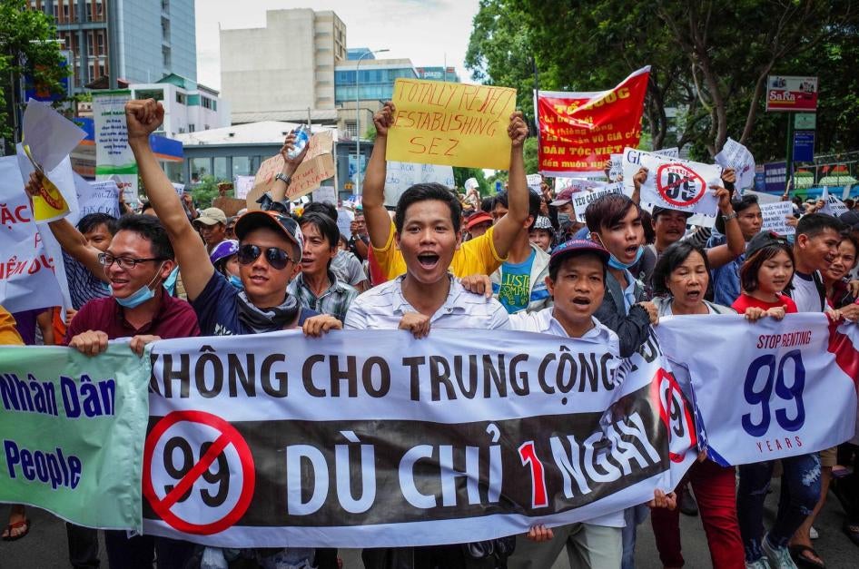 Vietnamese demonstrators protest a proposal to grant companies lengthy land leases at a march in Ho Chi Minh City, June 10, 2018.