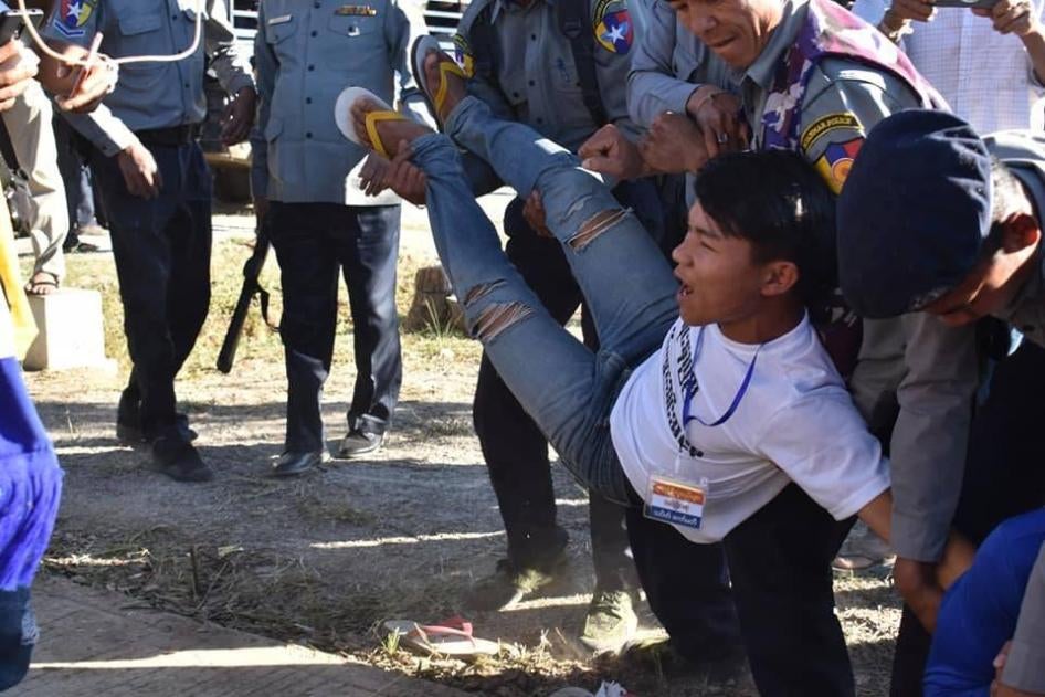 Police carry away a Karenni protester in Karenni State on February 12, 2019.