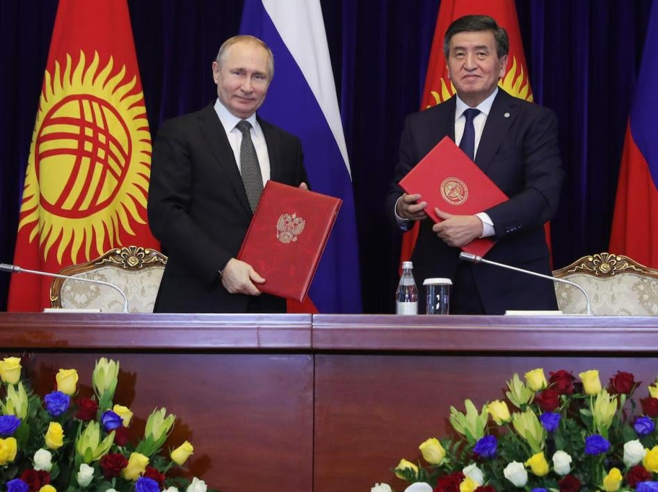 Russian President Vladimir Putin, left, and Kyrgyzstan's President Sooronbai Jeenbekov pose after a signing ceremony in Bishkek, Kyrgyzstan on March 28, 2019. 