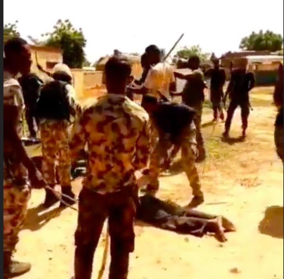 Image from video circulating online, which appears to implicate Nigerian security forces in abuse of a group of men. 
