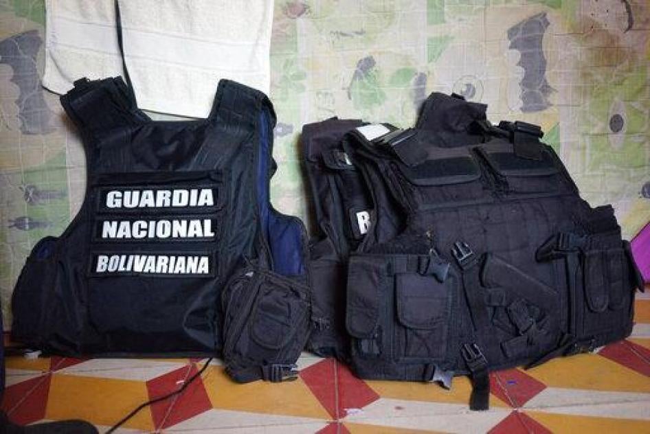 Chest vests belonging to defected members of Venezuela's Bolivarian National Guard sit in room where they are sleeping at a shelter run by a priest in Cucuta, Colombia, Monday, Feb. 25, 2019.