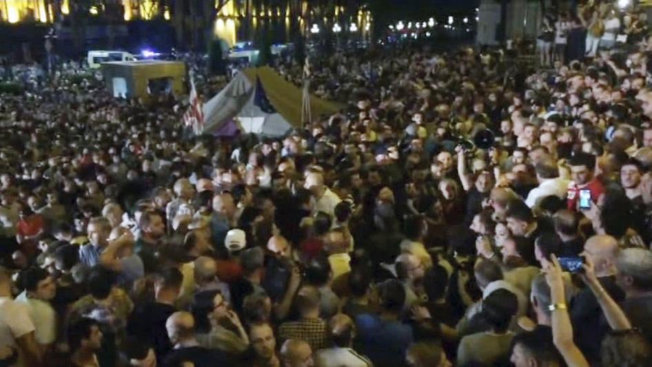 In this image from video, some thousands of protesters gather outside the parliament building in the Georgian capital of Tbilisi. 