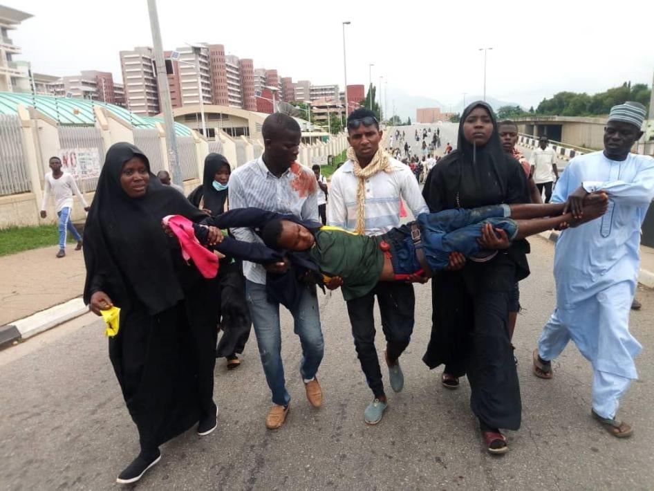  Members of the Shia Islamic Movement in Nigeria carry injured protester during protest march in Abuja, Nigeria on July 22, 2019. 