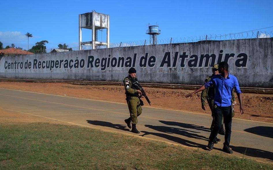 A police officer patrols the surroundings of the Altamira Regional Recovery Centre