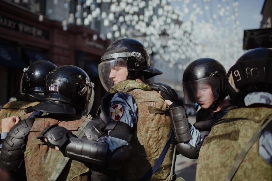 Police officers tasked with dispersing a peaceful protest in central Moscow on July 27, 2019. 