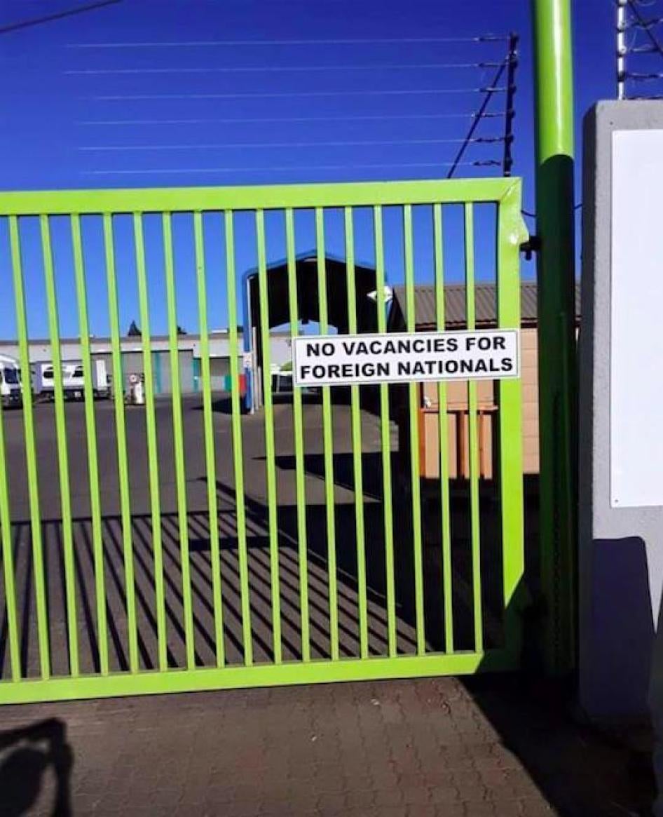 Sign at the gate of a trucking company in Durban that reads, “No Vacancies for Foreign Nationals.” © Private 2019. 