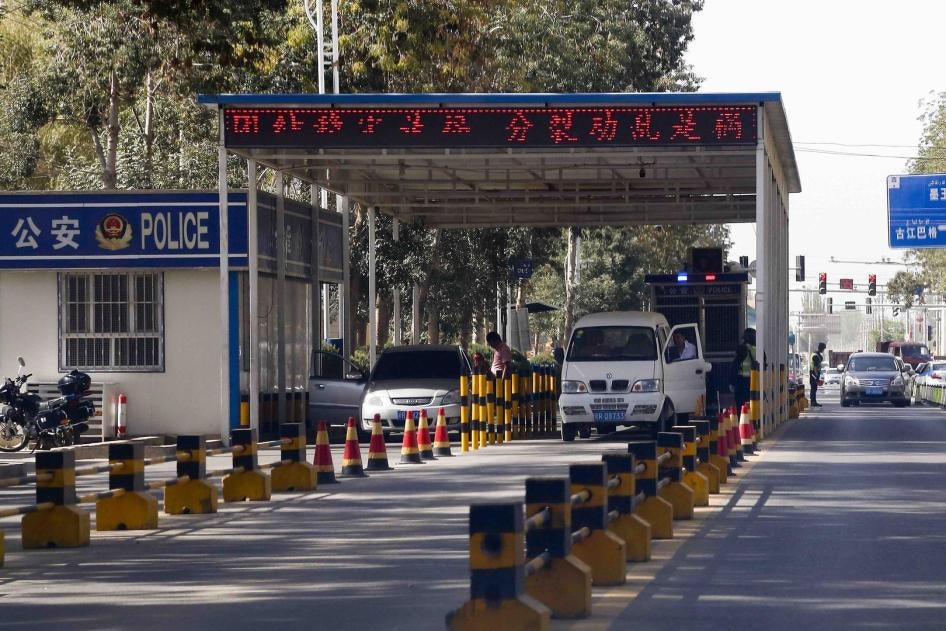 Drivers stop at a police checkpoint in Hotan, Xinjiang, September 21, 2018.
