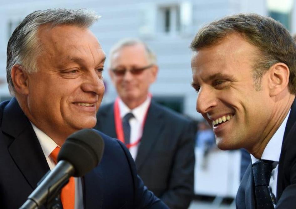 Hungary's Prime Minister Viktor Orban and French President Emmanuel Macron arrive at an EU summit in Salzburg, Austria on September 20, 2018.