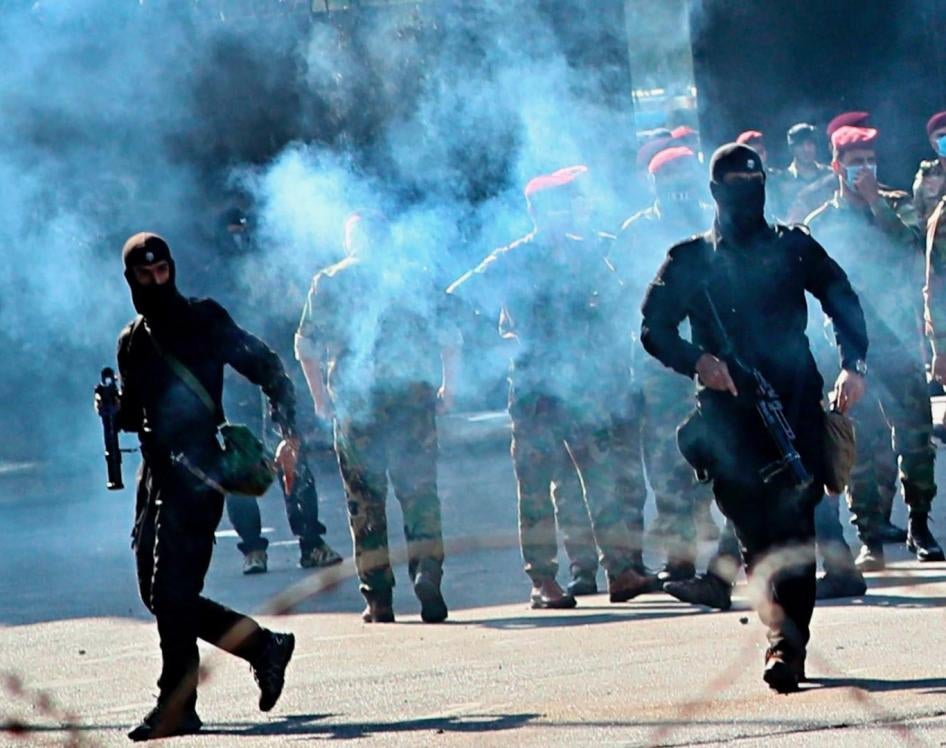 Iraqi security forces fire tear gas to disperse protesters during a demonstration in Baghdad, Iraq, Friday, Oct. 25, 2019. 