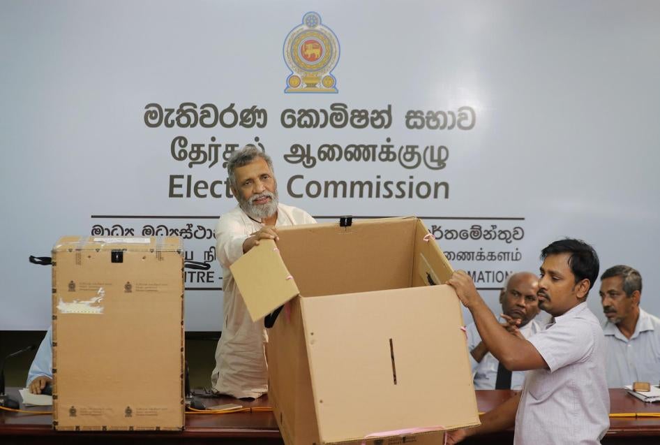 Sri Lanka's elections chief Mahinda Deshapriya displays ballot boxes that will be used in the upcoming presidential election in Colombo, Sri Lanka, Thursday, Oct. 31, 2019. The voting is scheduled to be held on Nov. 16. 