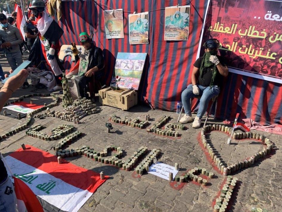Protesters in Tahrir Square arrange the tear gas canisters that security forces fired at them in Tahrir Square in different patriotic constellations.