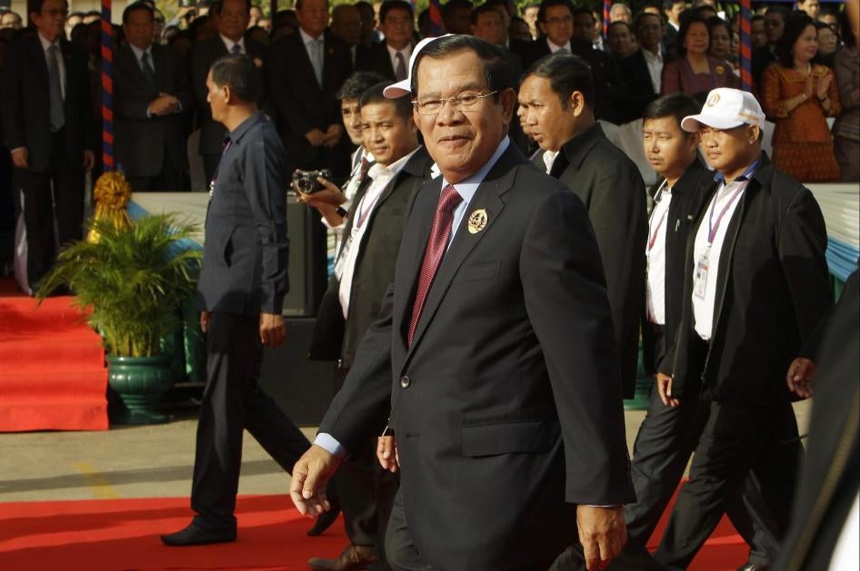 Cambodian Prime Minister Hun Sen, center, arrives for a ceremony of the 68th anniversary of the founding of his Cambodian People's Party in Phnom Penh, Cambodia, Friday, June 28, 2019.