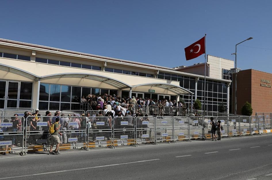 Supporters and relatives of human rights defender Osman Kavala and 15 others on trial for allegedly organizing the 2013 Gezi Park protests queue outside the Silivri Prison court house, Istanbul, June 24, 2019. Thousands are arbitrarily detained on terrori