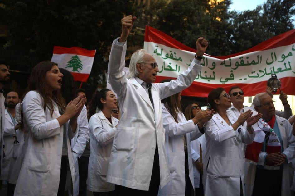 Lebanese doctors chant slogans as they take part in anti-government demonstrations in central Beirut on November 12, 2019. 