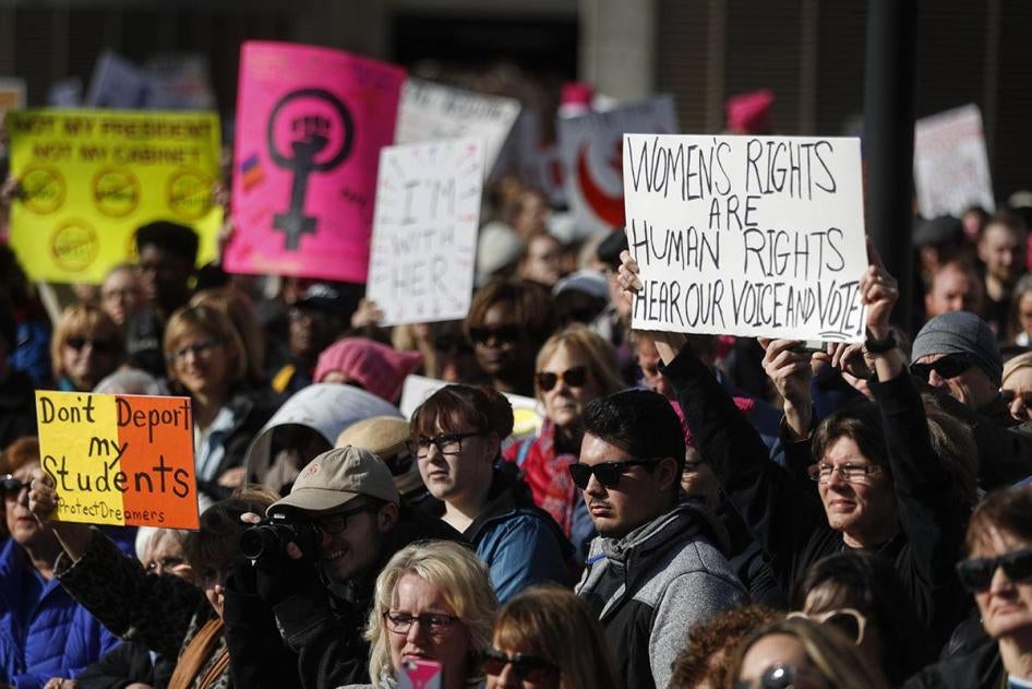 Protesters gather to participate in a Women's March highlighting demands for equal rights and equality for women, Saturday, Jan. 20, 2018, in Cincinnati, Ohio.