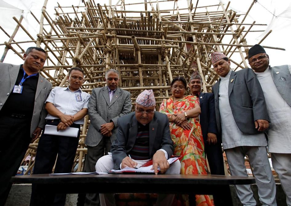 Prime Minister KP Sharma Oli visits the rebuilding site of a temple that collapsed during the April 2015 earthquake, Kathmandu, Nepal, April 25, 2019.