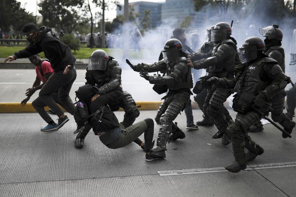 Police detain an anti-government demonstrator during a nationwide strike in Bogota, Colombia, on November 21, 2019.