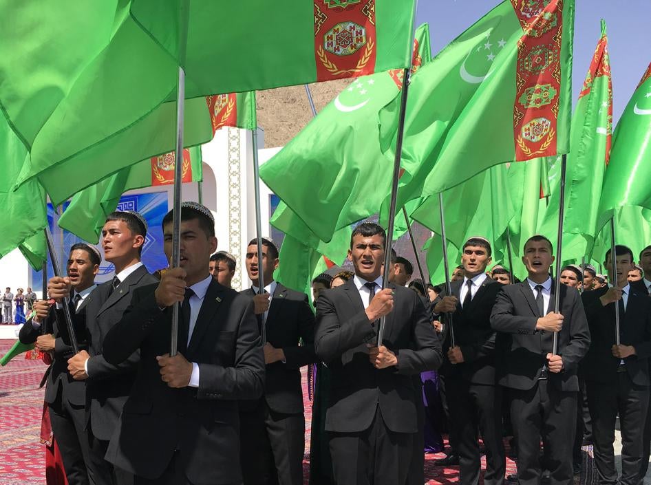People attend an opening ceremony of the cargo and passenger seaport in the Caspian sea town of Turkmenbashi, Turkmenistan May 2, 2018. 