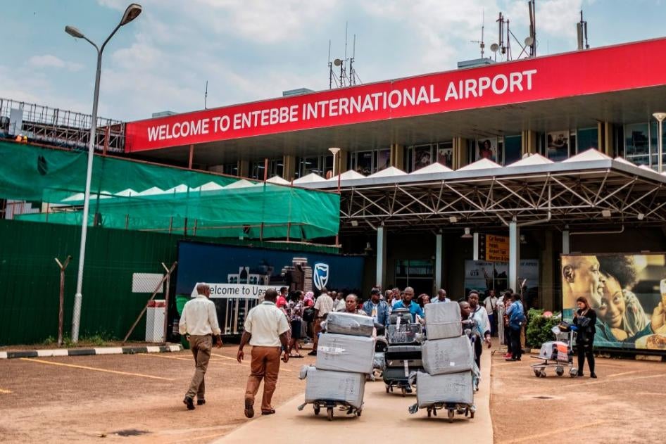 Passengers arriving on international flights leave the international arrivals lobby after they have been screened and cleared for any symptoms of the novel coronavirus at Entebbe Airport on March 3, 2020.