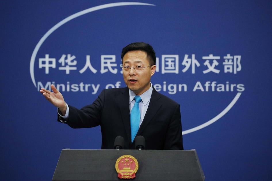 Chinese Foreign Ministry new spokesman Zhao Lijian gestures as he speaks during a daily briefing at the Ministry of Foreign Affairs office in Beijing, February 24, 2020. 