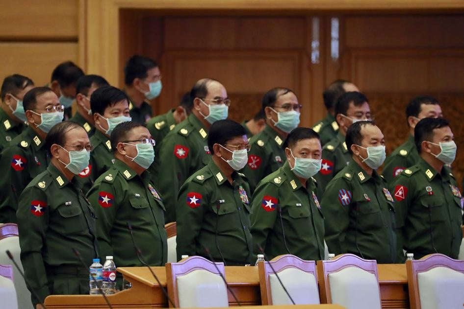 Myanmar military representatives stand during a regular session of the Union Parliament, March. 11, 2020.
