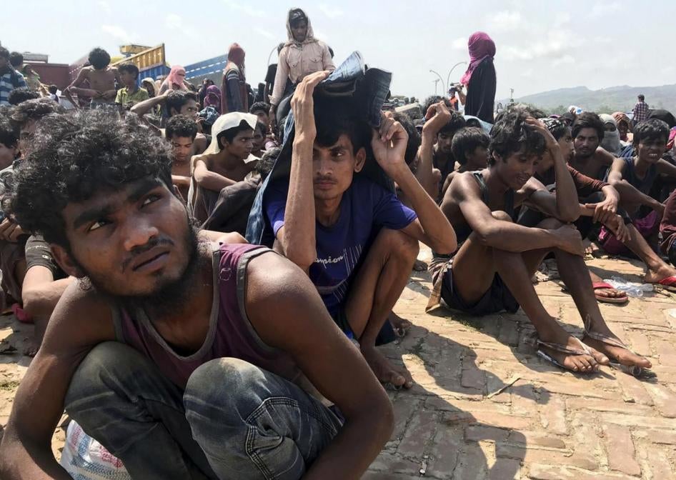 Rohingya refugees gather after being rescued in Teknaf near Cox’s Bazar, Bangladesh, April 16, 2020.