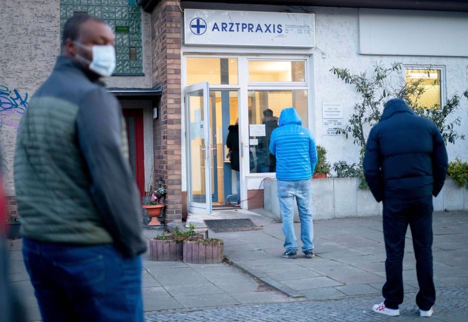 Patients line up in front of a medical practice in Berlin, Germany, to give blood samples for Covid-19 testing and possible detection of coronavirus antibodies, March 30, 2020.