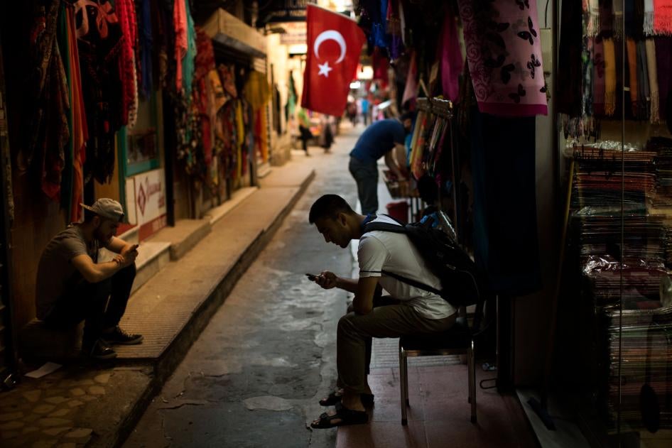 People check their phones at a market in central Istanbul, Turkey, July 18, 2019.