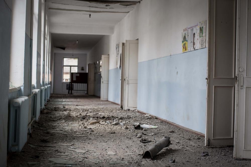 Rocket remnants in the hallway of a damaged school