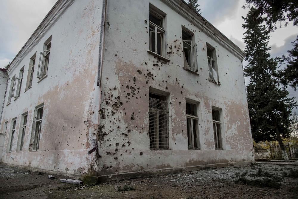 Exterior of a building with bullet holes